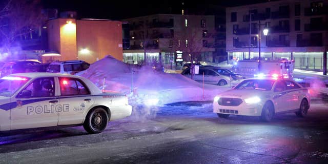 Jan. 29, 2017: Police survey the scene after deadly shooting at a mosque in Quebec City, Canada.