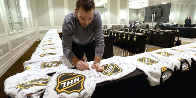 NASHVILLE, TN - JANUARY 29: Goaltender Braden Holtby #70 of the Washington Capitals signs jerseys during the Eastern Conference Skills Competition selection for the 2016 NHL All-Star Game at the Hilton Hotel on January 29, 2016 in Nashville, Tennessee. (Photo by Dave Sandford/NHLI via Getty Images)