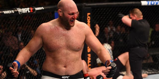 NEWARK, NJ - JANUARY 30: (L-R) Ben Rothwell celebrates his submission victory over Josh Barnett in their heavyweight bout during the UFC Fight Night event at the Prudential Center on January 30, 2016 in Newark, New Jersey. (Photo by Josh Hedges/Zuffa LLC/Zuffa LLC via Getty Images)