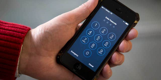 FILE - In this Feb. 17, 2016 file photo an iPhone is seen in Washington. The FBI is defending its decision to withhold information on how it unlocked an iPhone used by one of the San Bernardino, California, shooters.