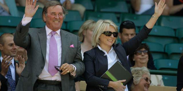 FILE - In this June 28, 2008 file photo, Terry Wogan and Jennifer Saunders are introduced to the crowd from Royal Box on the Centre Court at Wimbledon. Wogan, one of the best-known voices and faces on British television and radio, has died aged 77.