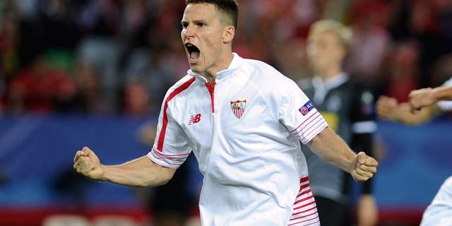 Sevilla's French forward Kevin Gameiro celebrates a goal during the UEFA Champions League group D football match Sevilla FC vs VfL Borussia Moenchengladbach at the Ramon Sanchez Pizjuan stadium in Sevilla on September 15, 2015. AFP PHOTO/ CRISTINA QUICLER (Photo credit should read CRISTINA QUICLER/AFP/Getty Images)