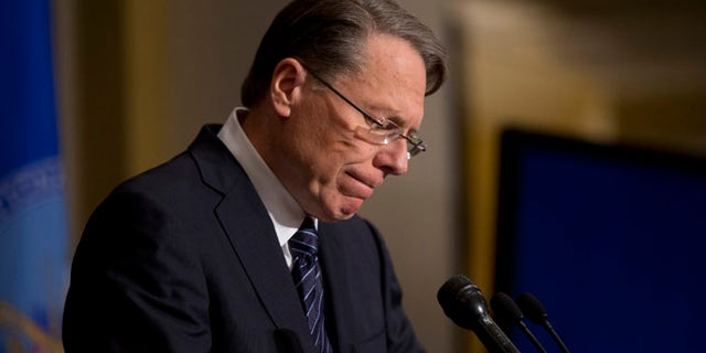 FILE: Dec. 21, 2012: National Rifle Association CEO Wayne LaPierre pauses as he makes a statement during a news conference in Washington.
