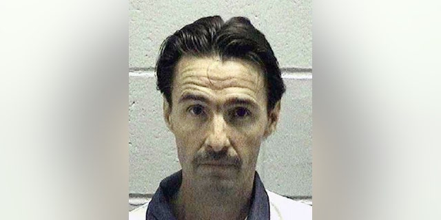 In this undated photo released by the Georgia Department of Corrections, J.W. Ledford Jr., poses for a photo. Georgia Attorney General Chris Carr said in a news release Wednesday, April 26, 2017, that 45-year-old Ledford, a death row inmate convicted of killing a 73-year-old doctor, is scheduled to die May 16 at the state prison in Jackson, Ga. (Georgia Department of Corrections via AP)