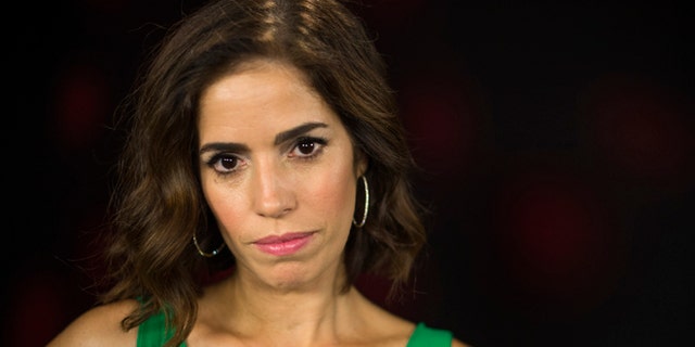In this Friday, June 20, 2014 photo, Ana Ortiz poses for a portrait in Los Angeles. Ortiz is the star of the Lifetime TV series "Devious Maids," the season finale of which airs Sunday night, July 13, 2014. (Photo by Jordan Strauss/Invision/AP)