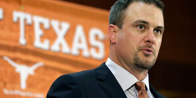 FILE - In this Nov. 27, 2016, file photo, Tom Herman talks to the media during a news conference where he was introduced as coach of the Texas college football team. Considering all the hype about Herman, there will not be much of a grace period for him in Austin. Former coach Charlie Strong left behind a pretty good roster and told the world that the Longhorns would win 10 games in 2017 no matter who is coaching. (AP Photo/Eric Gay, File)