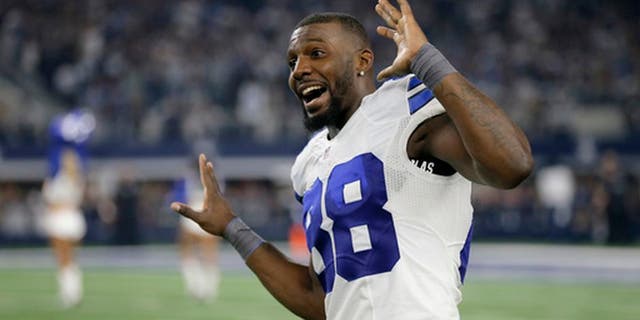FILE - In this Dec. 26, 2016, file photo, Dallas Cowboys' Dez Bryant jokes with teammates as he dances on the field as players warm up for an NFL football game against the Detroit Lions in Arlington, Texas. The Cowboys face the Green Bay Packers this weekend in a rematch of a 2015 playoff game, but this time in Arlington. (AP Photo/Brandon Wade, File