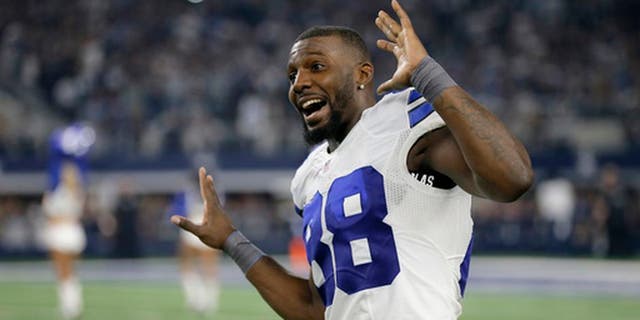 FILE - In this Dec. 26, 2016, file photo, Dallas Cowboys' Dez Bryant jokes with teammates as he dances on the field as players warm up for an NFL football game against the Detroit Lions in Arlington, Texas. The Cowboys face the Green Bay Packers this weekend in a rematch of a 2015 playoff game, but this time in Arlington. (AP Photo/Brandon Wade, File