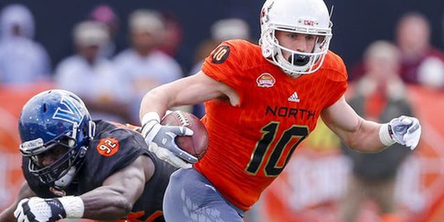 North squad wide receiver Cooper Kupp of Eastern Washington (10) carries the ball as he gets around South squad defensive end Tanoh Kpassagnon of Villanova (92) during the first half of the Senior Bowl NCAA college football game, Saturday, Jan. 28, 2017, at Ladd-Peebles Stadium in Mobile, Ala. (AP Photo/Butch Dill)