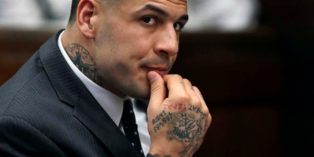 FILE - In this Jan. 19, 2017, file photo, former New England Patriots NFL football player Aaron Hernandez listens during a pretrial hearing at Suffolk Superior Court in Boston. Jury selection for his trial is scheduled to begin on Feb. 13, 2017. He is charged with the July 2012 killings of Daniel de Abreu and Safiro Furtado who he encountered in a Boston nightclub. Hernandez already is serving a life sentence in the 2013 killing of semi-professional football player Odin Lloyd. (AP Photo/Charles Krupa, Pool, File)