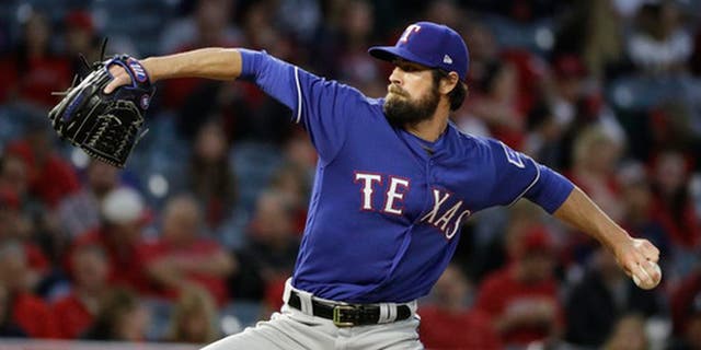 Texas Rangers starting pitcher Cole Hamels throws against the Los Angeles Angels during the first inning of a baseball game, Tuesday, April 11, 2017, in Anaheim, Calif. Cole Hamels makes his fourth start this season for Texas on Friday, April 21,, and the Rangers left-hander is still looking for his first decision when the Rangers host Kansas City. (AP Photo/Jae C. Hong)