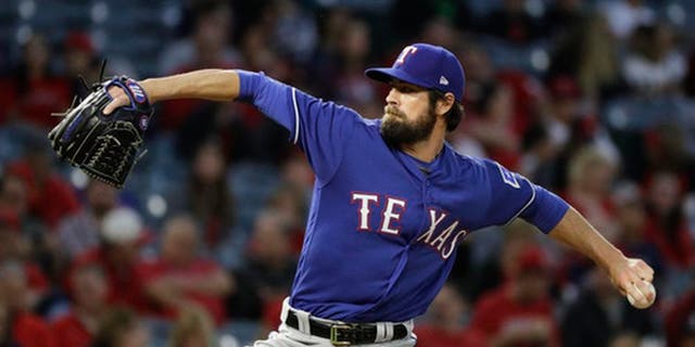 Texas Rangers starting pitcher Cole Hamels throws against the Los Angeles Angels during the first inning of a baseball game, Tuesday, April 11, 2017, in Anaheim, Calif. Cole Hamels makes his fourth start this season for Texas on Friday, April 21,, and the Rangers left-hander is still looking for his first decision when the Rangers host Kansas City. (AP Photo/Jae C. Hong)