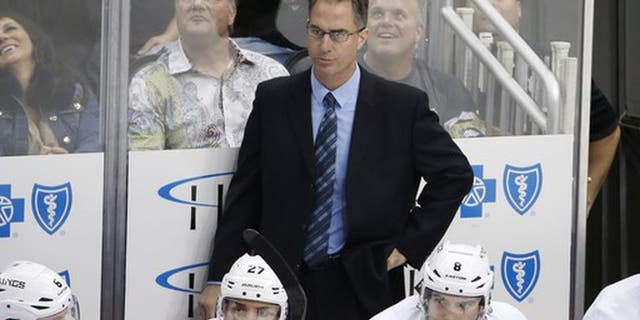 Los Angeles Kings assistant coach John Stevens stands behind his bench during the first period of an NHL hockey game against the Pittsburgh Penguins in Pittsburgh, Thursday, Oct. 30, 2014. The Penguins won 3-0. (AP Photo/Gene J. Puskar)