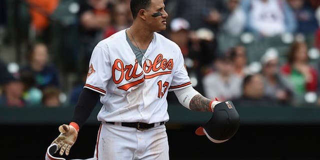 Baltimore Orioles Manny Machado looks to the mound after a pitch was thrown near his head by Boston Red Sox pitcher Matt Barnes during the eighth inning of a baseball game, Sunday, April 23, 2017, in Baltimore. (AP Photo/Gail Burton)