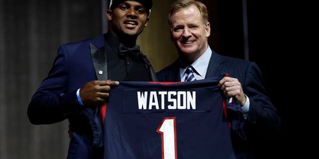 Clemson's Deshaun Watson, left, poses with NFL commissioner Roger Goodell after being selected by the Houston Texans during the first round of the 2017 NFL football draft, Thursday, April 27, 2017, in Philadelphia. (AP Photo/Matt Rourke)