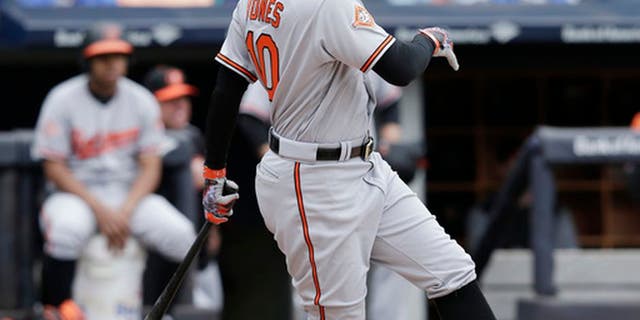 Baltimore Orioles' Adam Jones hits an RBI-single during the third inning of a baseball game against the New York Yankees at Yankee Stadium, Sunday, April 30, 2017, in New York. (AP Photo/Seth Wenig)