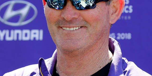 Minnesota Vikings head coach Mike Zimmer smiles in response to a question during the NFL football team's rookies minicamp Friday, May 5, 2017, in Eden Prairie, Minn. (AP Photo/Jim Mone)