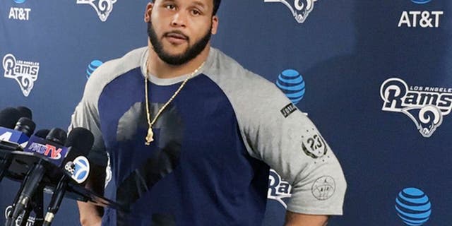 Los Angeles Rams defensive lineman Aaron Donald speaks with reporters after the first official day of the team's offseason football training program, Monday, April 10, 2017, in Thousand Oaks, Calif. (AP Photo/Greg Beacham)