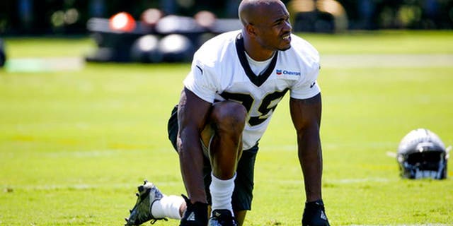 New Orleans Saints running back Adrian Peterson (28) stretches before NFL football practice in Metairie, La., Thursday, May 25, 2017. (AP Photo/Derick E. Hingle)