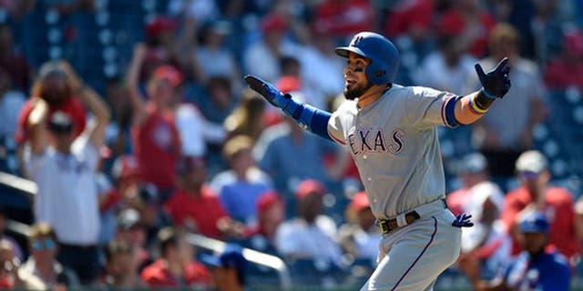Texas Rangers' Robinson Chirinos reacts as he heads home after he hit a three-run home run during the 11th inning of a baseball game against the Washington Nationals, Saturday, June 10, 2017, in Washington. The Rangers won 6-3 in 11 innings. (AP Photo/Nick Wass)