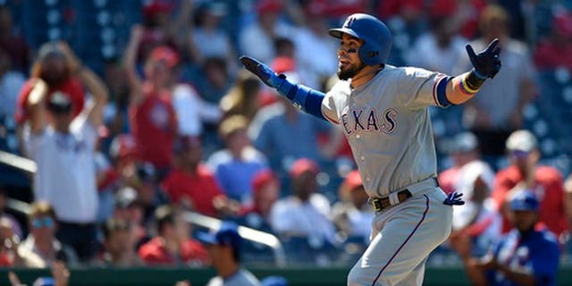 Texas Rangers' Robinson Chirinos reacts as he heads home after he hit a three-run home run during the 11th inning of a baseball game against the Washington Nationals, Saturday, June 10, 2017, in Washington. The Rangers won 6-3 in 11 innings. (AP Photo/Nick Wass)