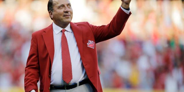 FILE - In this July 14, 2015 file photo, Johnny Bench is introduced as one of the Cincinnati Reds Franchise Four before the MLB All-Star baseball game, in Cincinnati. Major League Baseball Hall of Famer Bench has launched a new cellphone app aimed at combatting bullying in schools nationwide. The Cincinnati Reds catcher officially launched his "Smithfield School App" on Thursday, Nov. 17, 2016, at the Montgomery Inn Boathouse in downtown Cincinnati. (AP Photo/Jeff Roberson, File)