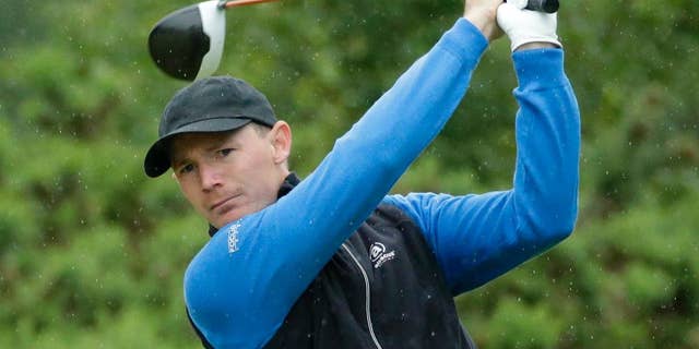 Bill Haas of the US plays his tee shot at the 12th during the second round of the British Open Golf Championships at the Royal Troon Golf Club in Troon, Scotland, Friday, July 15, 2016. (AP Photo/Matt Dunham)