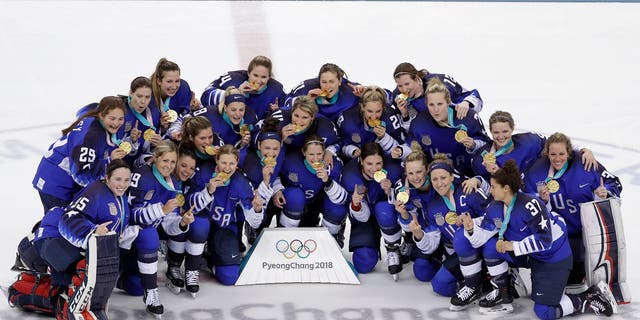 United States hockey team celebrate with their gold medals after beating Canada in the women's gold medal hockey game at the 2018 Winter Olympics in South Korea on Thursday, Feb. 22, 2018. 