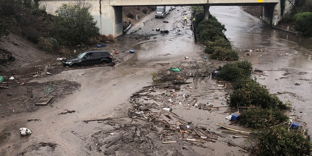 Abadoned cars stuck in flooded water on the freeway after a mudslide in Montecito, California, U.S. in this photo provided by the Santa Barbara County Fire Department, January 9, 2018.