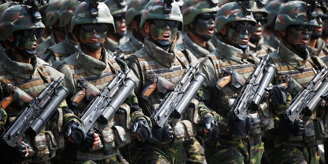 North Korean soldiers march and shout slogans during a military parade marking the 105th birth anniversary of the country's founding father, Kim Il-sung, in Pyongyang, North Korea, on April 15, 2017.