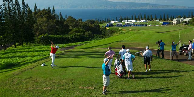 Sang-Moon Bae, of South Korea, drives on the 18th tee during the third round of the Tournament of Champions golf tournament, Sunday, Jan. 11, 2015, in Kapalua, Hawaii. (AP Photo/Marco Garcia)