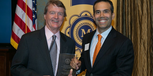 UT Austin President Bill Powers and Texas Land Commissioner George P. Bush at a reception on campus.