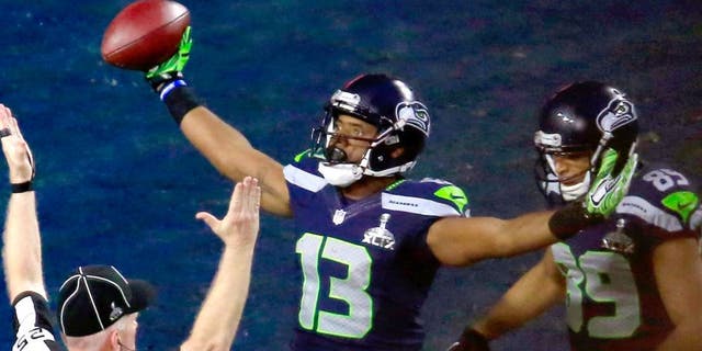 Chris Matthews #13 of the Seattle Seahawks celebrates scoring an 11 yard touchdown late in the second quarter with Doug Baldwin #89 against the New England Patriots during Super Bowl XLIX at University of Phoenix Stadium on February 1, 2015 in Glendale, Arizona. (Photo by Jamie Squire/Getty Images)