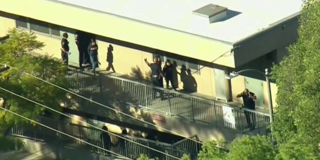 A female student was taken into custody after shots were fired inside a Los Angeles middle school classroom.