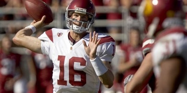 Southern California quarterback Mitch Mustain (16) throws to fullback Stanley Havili (31) during the fourth quarter of an NCAA college football game against Washington State on Saturday, Sept. 25, 2010, at Martin Stadium in Pullman, Wash.