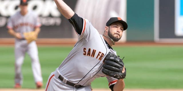 Sep 27, 2015; Oakland, CA, USA; San Francisco Giants relief pitcher George Kontos (70) throws a pitch against the Oakland Athletics during the sixth inning at O.co Coliseum. The San Francisco Giants defeated the Oakland Athletics 5-4. Mandatory Credit: Ed Szczepanski-USA TODAY Sports