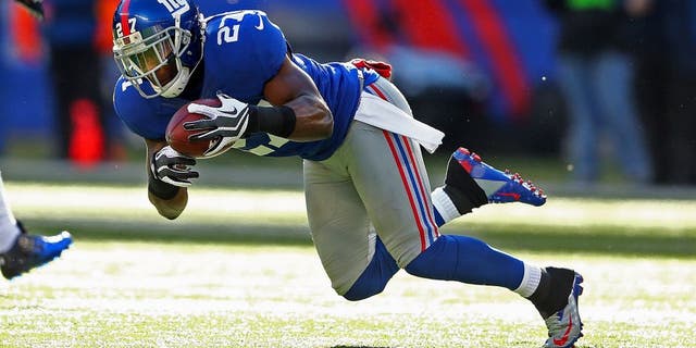 EAST RUTHERFORD, NJ - DECEMBER 30: Stevie Brown #27 of the New York Giants intercepts the ball against the Philadelphia Eagles during their game against the at MetLife Stadium on December 30, 2012 in East Rutherford, New Jersey. (Photo by Al Bello/Getty Images)