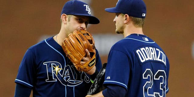 DETROIT, MI - SEPTEMBER 09: Evan Longoria #3 (L) and Jake Odorizzi #23 of the Tampa Bay Rays talk on the pitchers mound during the game against the Detroit Tigers at Comerica Park on September 9, 2015 in Detroit, Michigan. The Rays defeated the Tigers 8-0. (Photo by Mark Cunningham/MLB Photos via Getty Images)