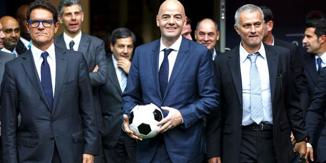 LONDON, UNITED KINGDOM - FEBRUARY 01: FIFA Presidential candidate Gianni Infantino (C) walks with Fabio Capello (L) and former Chelsea manager Jose Mourinho (R) after Gianni Infantino's press conference at Wembley Stadium on February 1, 2016 in London, United Kingdom. Gianni Infantino unveils his 90 day plan that he will implement if he is elected as FIFA President. (Photo by Tolga Akmen/Anadolu Agency/Getty Images)