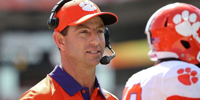 MIAMI GARDENS, FL - OCTOBER 24: Head coach Dabo Swinney of the Clemson Tigers reacts to a play during a game against the Miami Hurricanes at Sun Life Stadium on October 24, 2015 in Miami Gardens, Florida. (Photo by Mike Ehrmann/Getty Images)