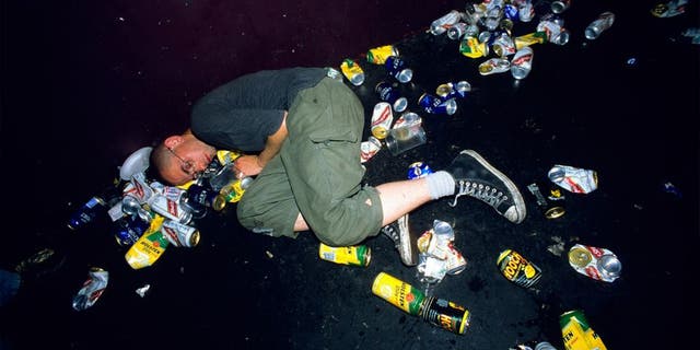 Punk asleep amoungst litter and beer cans on the floor at a gig. London Astoria 1998. (Photo by: PYMCA/UIG via Getty Images)