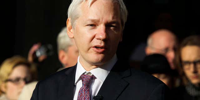 FILE - In this Dec. 5, 2011 file photo, WikiLeaks founder Julian Assange makes a statement to media gathered outside the High Court in London.