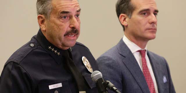 FEb. 4, 2016: Los Angeles Police Chief Charlie Beck, left, and Los Angeles Mayor Eric Garcetti take questions about the bodies found at a park, during a news conference at LAPD headquarters in Los Angeles.