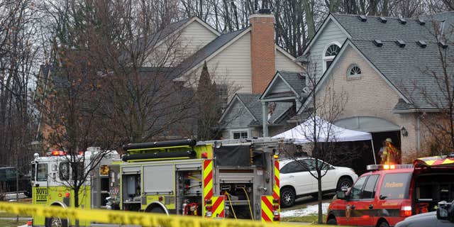 Jan. 31, 2016: Police and fire officials investigate a house fire that killed five people at a home in Novi, Mich.