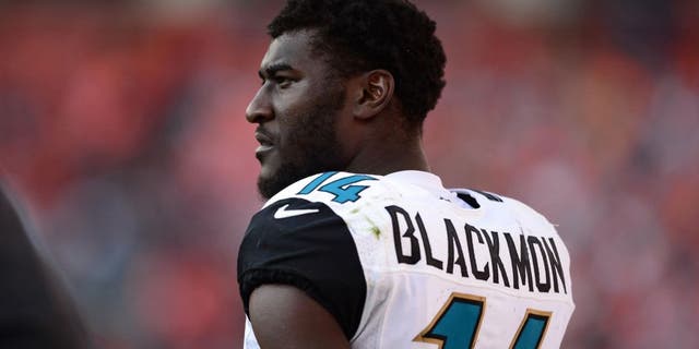 Oct 13, 2013; Denver, CO, USA; Jacksonville Jaguars wide receiver Justin Blackmon (14) on the sidelines in the fourth quarter against the Denver Broncos at Sports Authority Field at Mile High. The Broncos defeated the Jaguars 35-19. Mandatory Credit: Ron Chenoy-USA TODAY Sports