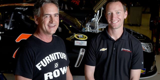DENVER, CO - JUNE 08: Furniture Row Racing crew chief Cole Pearn (right) and general manager Joe Garone pose at the Furniture Row Racing shop on Monday, June 8, 2015. Team driver Martin Truex Jr. won the Axalta 400 at Pocono Raceway on Sunday. (Photo by AAron Ontiveroz/The Denver Post via Getty Images)