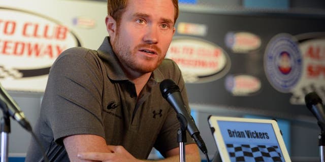 FONTANA, CA - MARCH 22: Brian Vickers, driver of the Michael Waltrip Racing Toyota, answers questions from media during a press conference before the NASCAR Sprint Cup Series Auto Club 400 at Auto Club Speedway on March 22, 2015 in Fontana, California. Vickers was forced to withdraw from competition due to blood clots. (Photo by Robert Laberge/Getty Images)