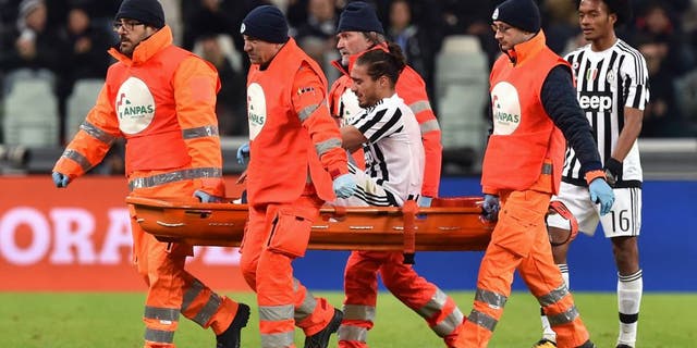 TURIN, ITALY - FEBRUARY 03: Martin Caceres of Juventus FC is helped from the pitch after sustaining an injury during the Serie A match between Juventus FC and Genoa CFC at Juventus Arena on February 3, 2016 in Turin, Italy. (Photo by Valerio Pennicino/Getty Images)