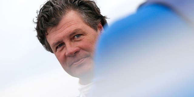 TALLADEGA, AL - OCTOBER 24: Michael Waltrip, driver of the #98 Maxwell House Toyota, stands on the grid during qualifying for the NASCAR Sprint Cup Series CampingWorld.com 500 at Talladega Superspeedway on October 24, 2015 in Talladega, Alabama. (Photo by Brian Lawdermilk/Getty Images)