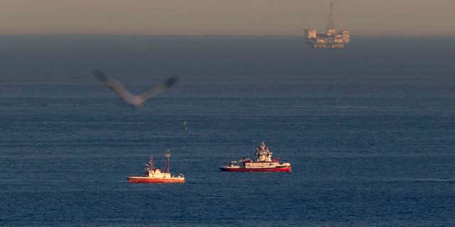 Feb. 5, 2016: Rescue boats search for wreckage from two small planes that collided in midair and plunged into the ocean off of Los Angeles harbor in San Pedro, Calif.